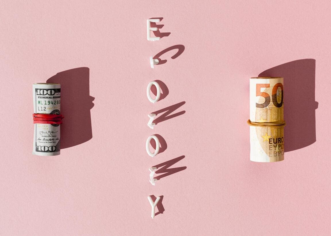 Flat lay collage of banknotes and economy wording
